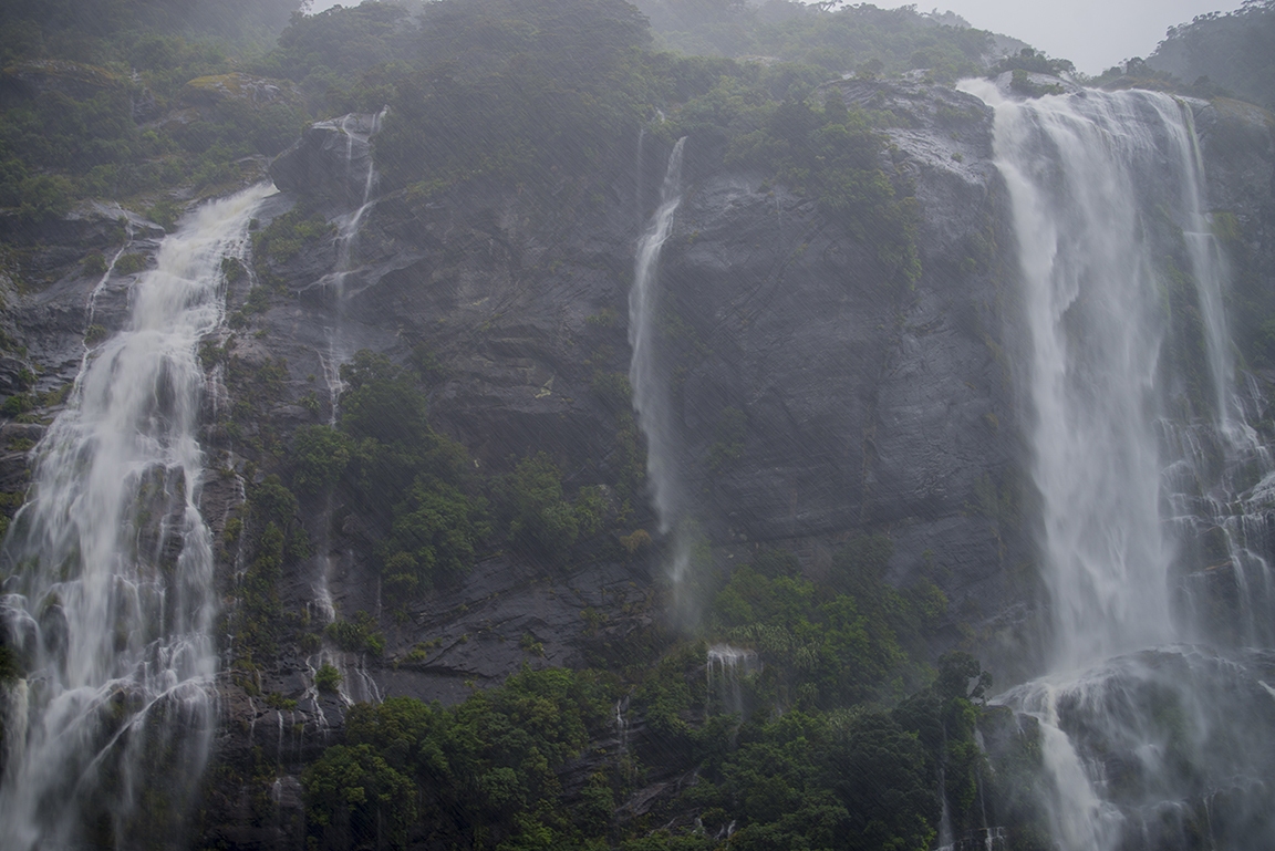 Misty waterfalls in Doubtful Sound, Fjordland National Park