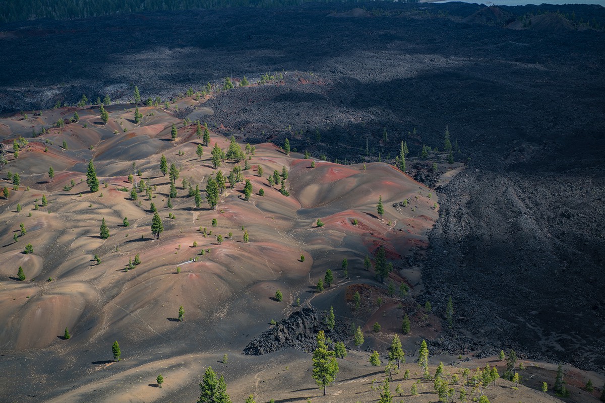 Lava bed abutting Painted Dunes with Snag Lake in background